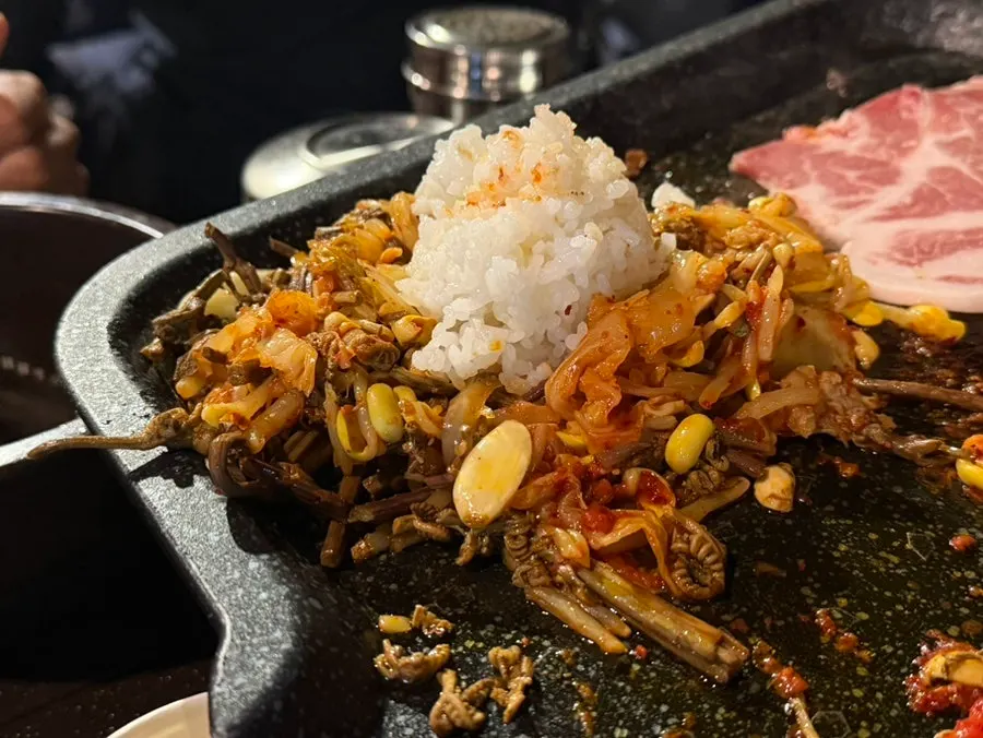 Extra bowl of rice added next to the grill for fried rice
