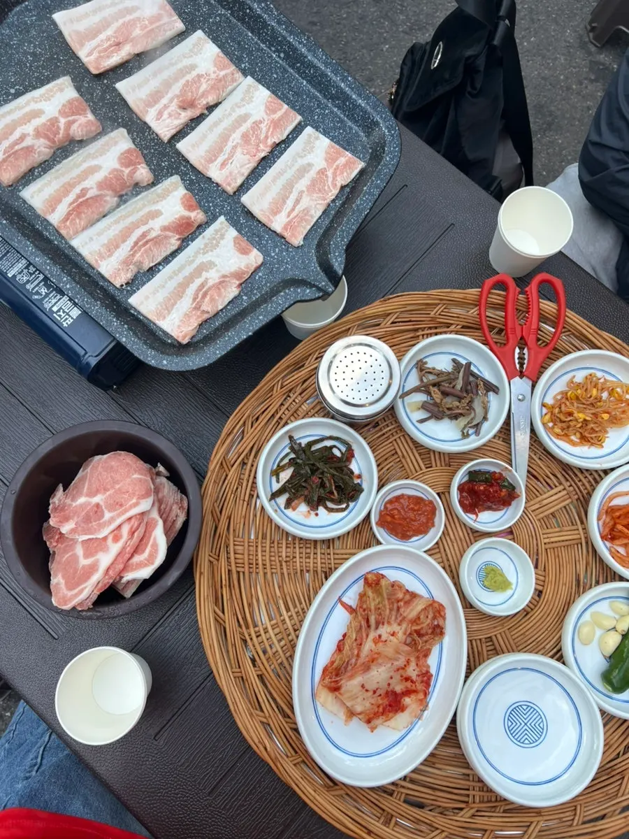 Cabbage kimchi, seasoned bean sprouts, and scallion salad banchan