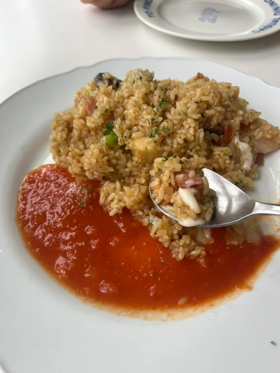 Close-up of a spoonful of shrimp pilaf