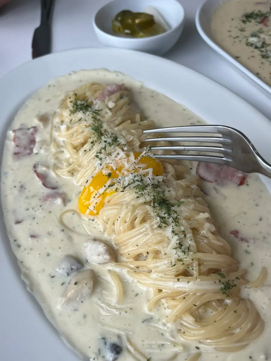 Carbonara with the popped egg yolk mixed in