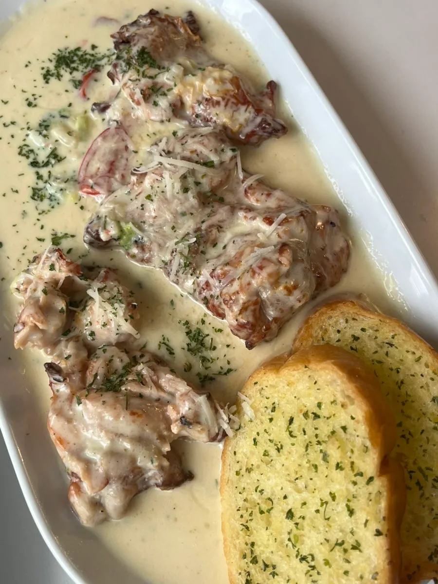 Close-up of the cream sauce on the chicken steak