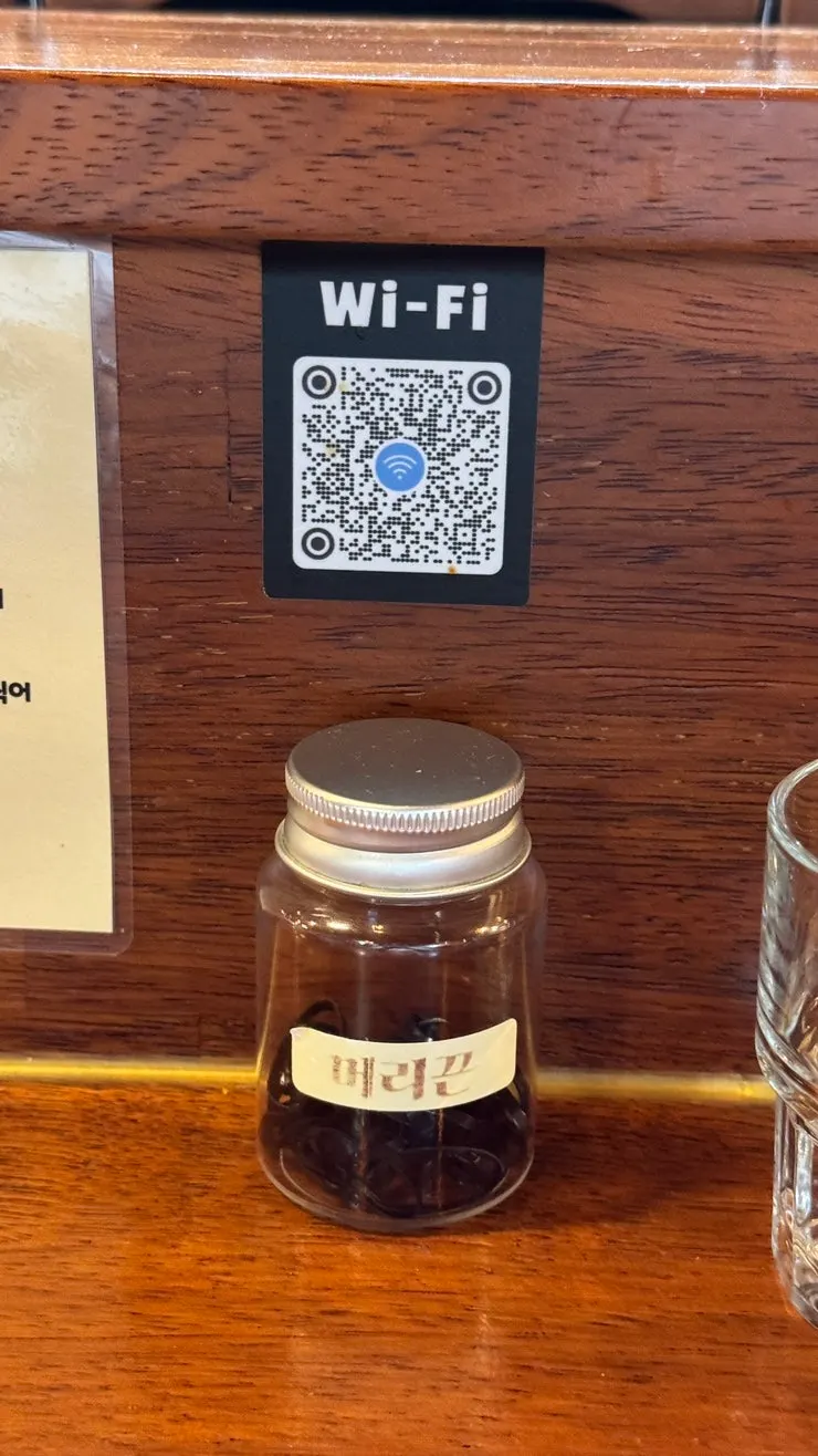 Hair ties and a tsukemen how-to-eat guide on the table
