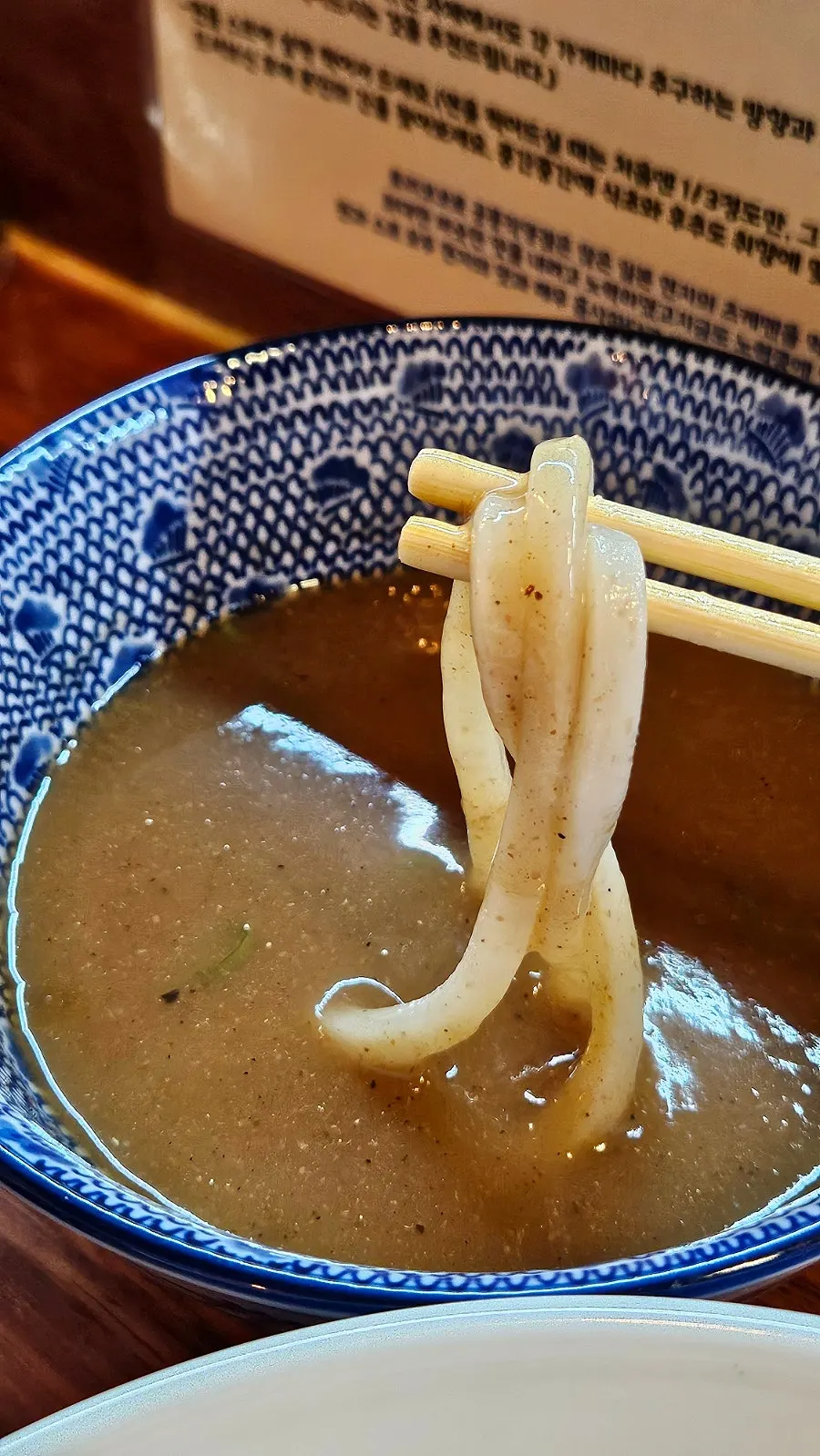 Dipping tsukemen noodles into salt