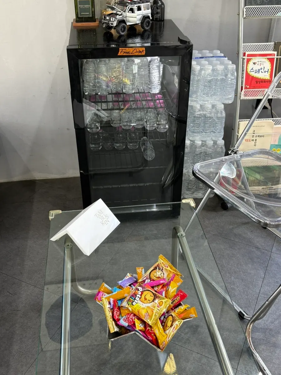 Snacks and drinks set out in the salon waiting area