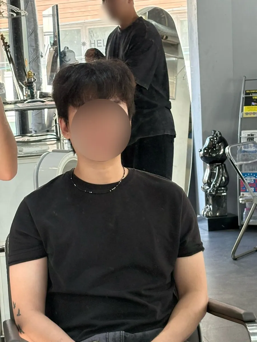 Side view before the service showing grown-out sideburns
