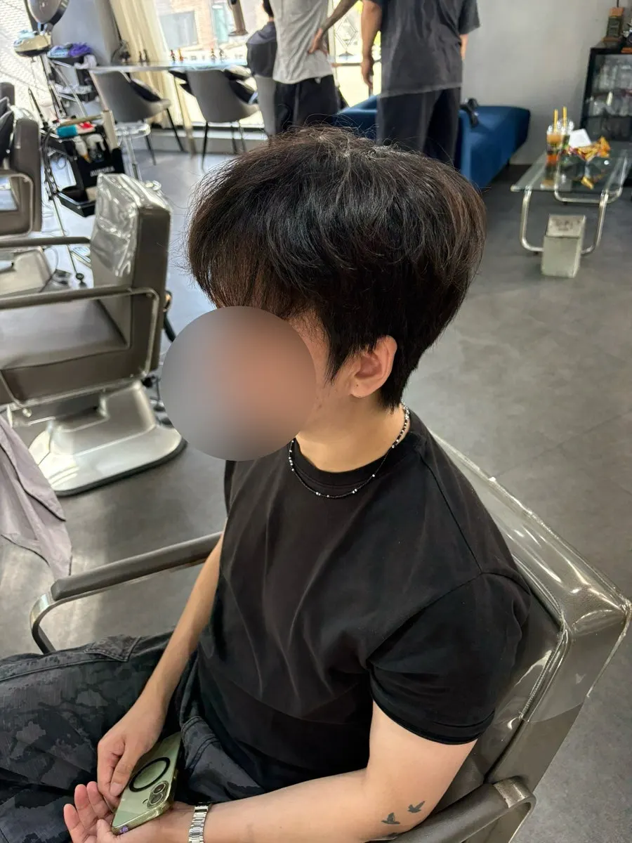 Front view before the service showing shaggy hair around the ears