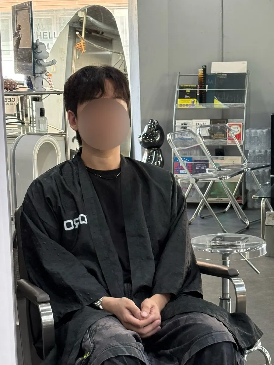 Side view of calmer men's hair after the down perm
