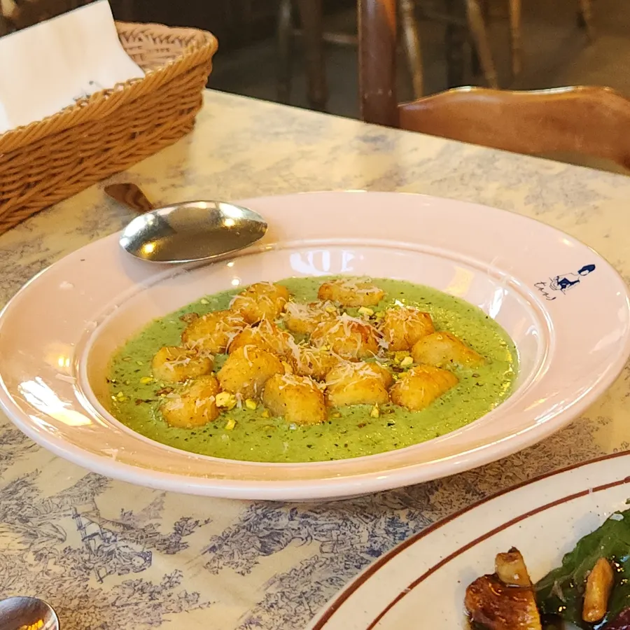 A plate of the fall season basil cream gnocchi