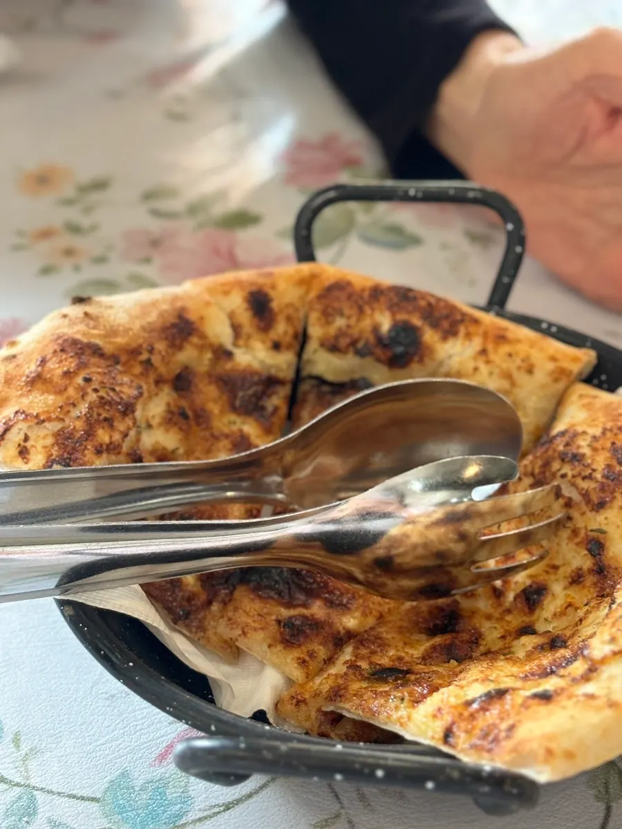 A plate of half-moon focaccia with garlic butter