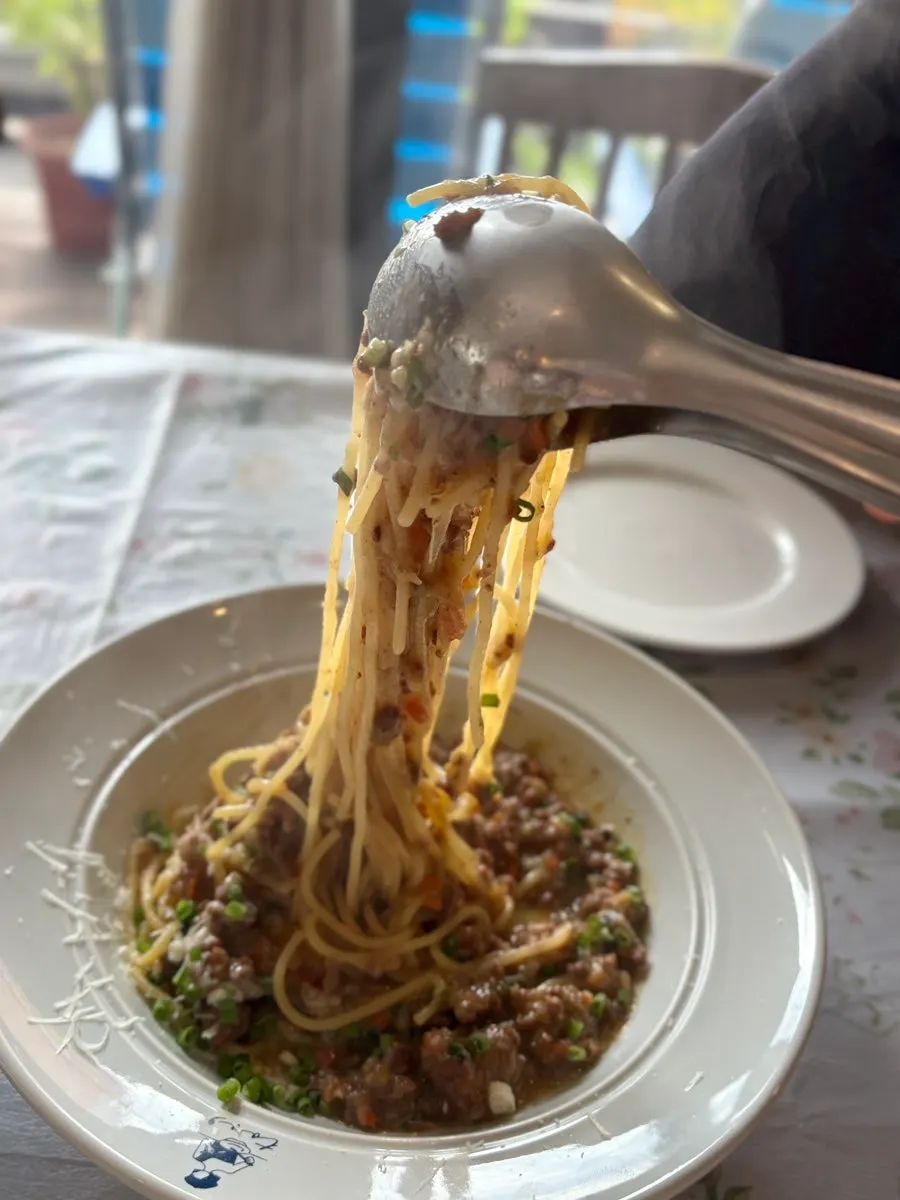 Truffle pasta lifted up with a fork