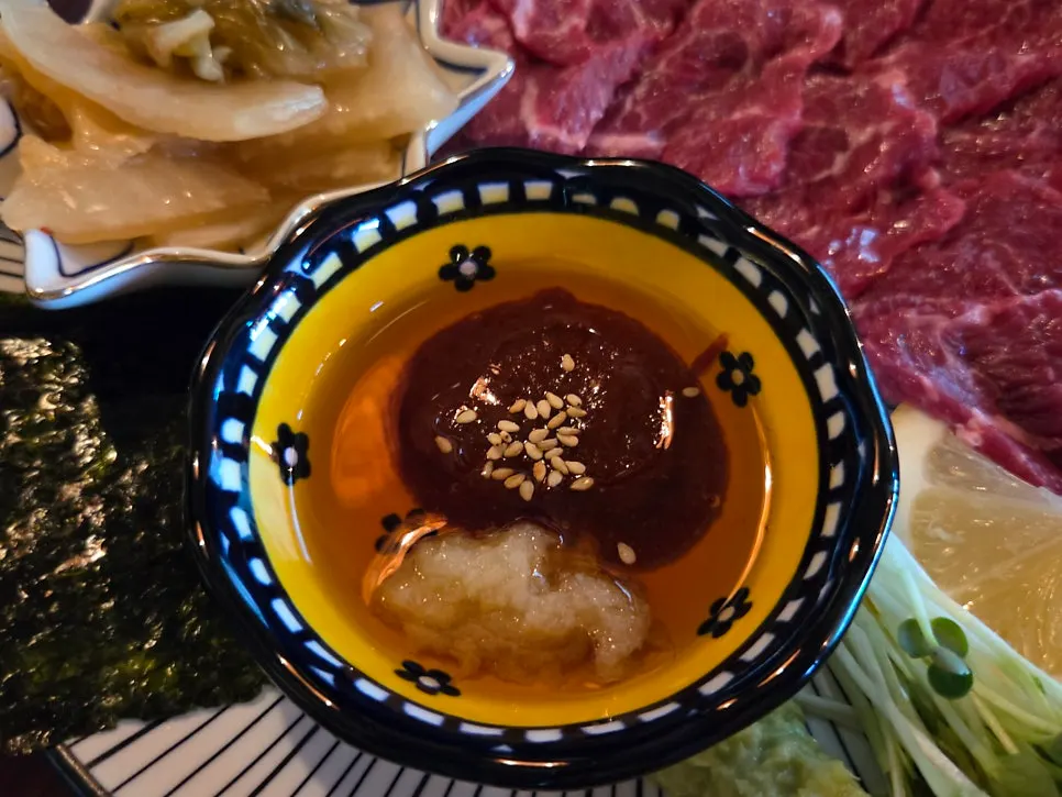 Wagyu beef sashimi with side dishes