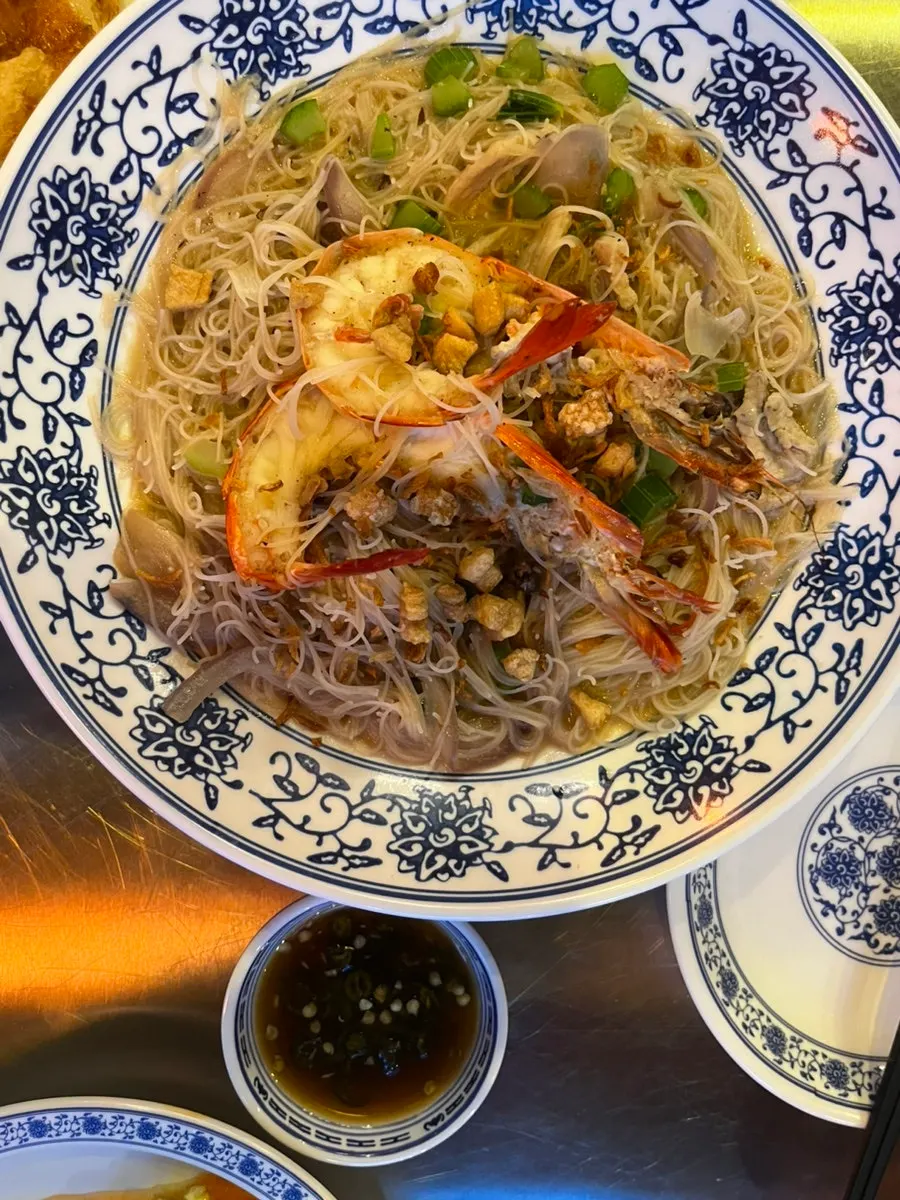A bowl of shrimp broth fried noodles
