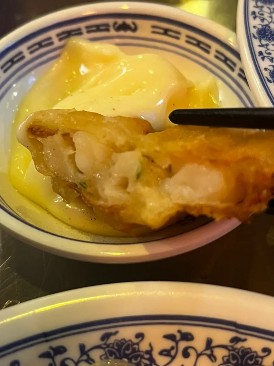 Table set with shrimp noodles and fried shrimp rolls together
