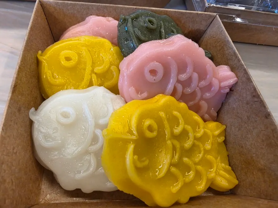 Fish-shaped rice cakes in yellow, pink, white, and green