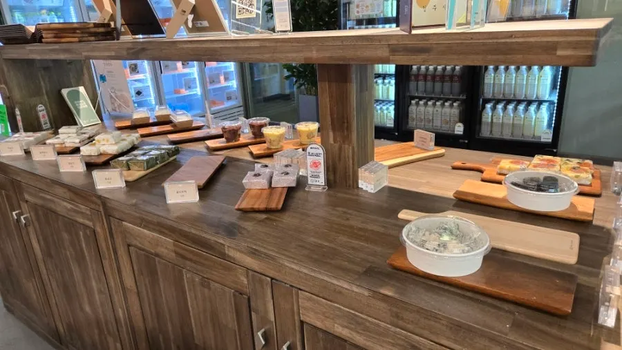 Display counter with a wide variety of rice cakes at Tteokmama Gaesin Branch