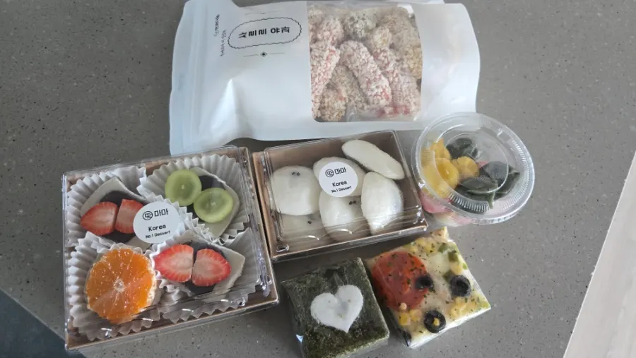 A spread of Tteokmama rice cakes unpacked at home
