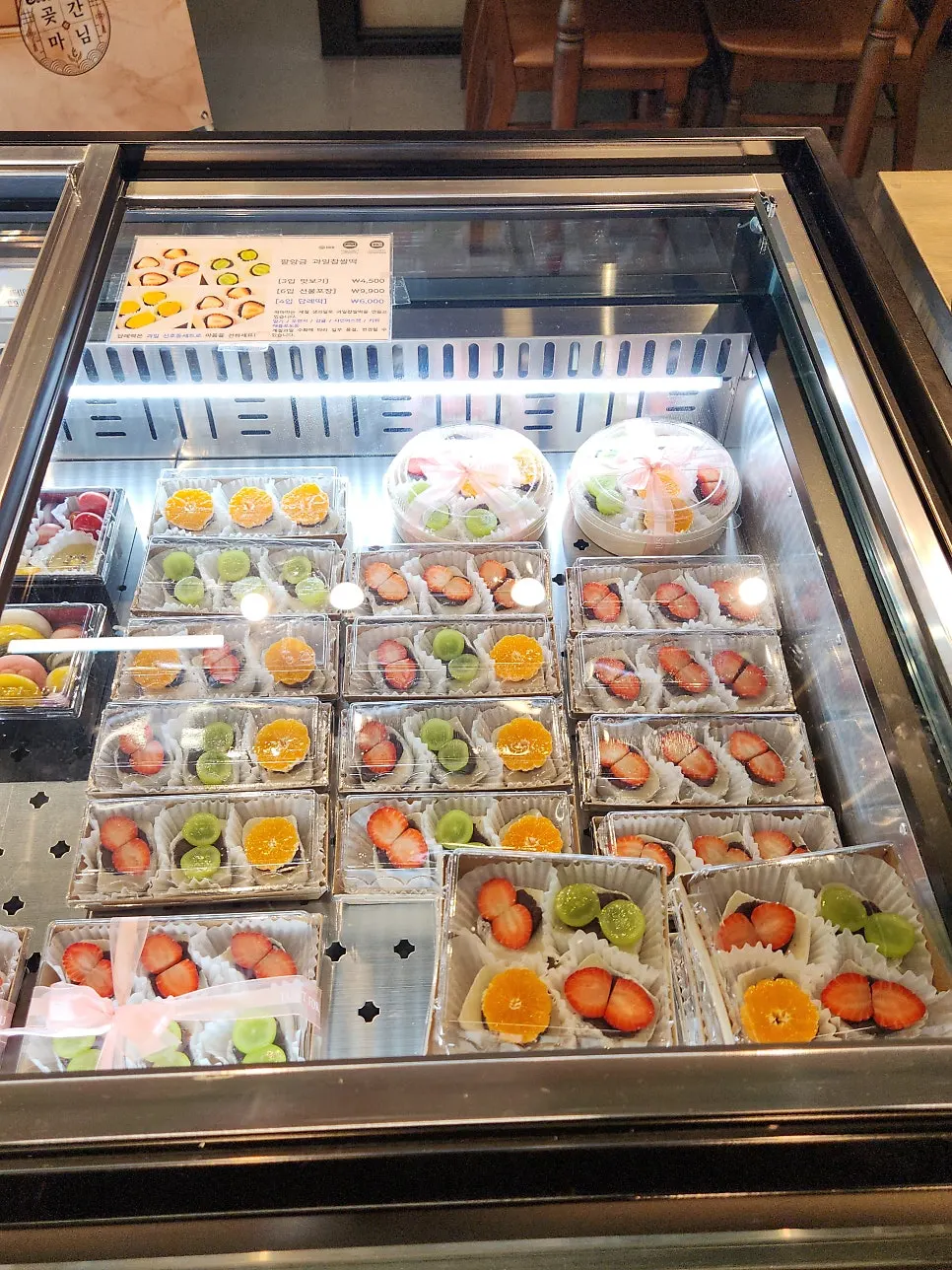 Display case with fruit chapssaltteok and gift sets