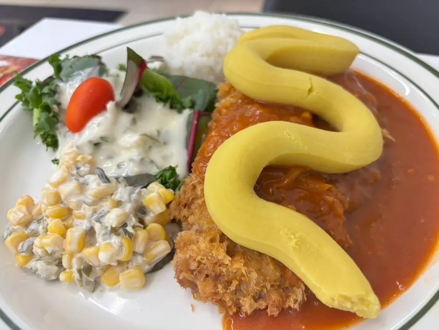 Cross-section of the cutlet showing sweet potato and cheese filling
