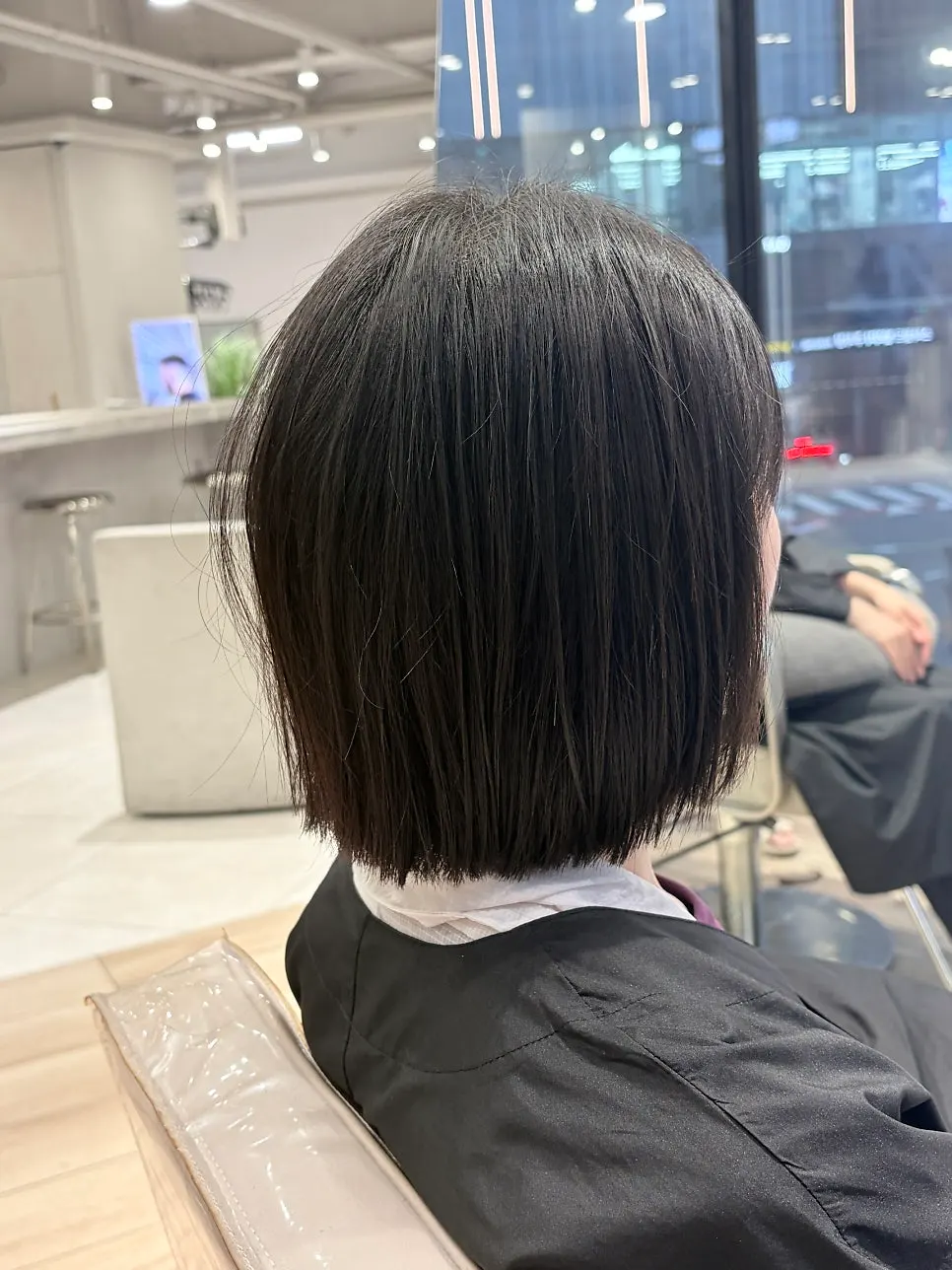 Side profile and hair texture of the tassel cut