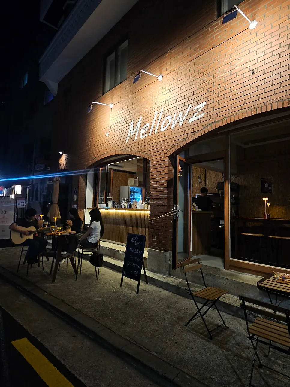 Mellows exterior with soft lighting