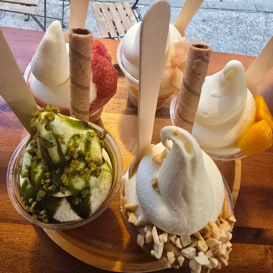 Strawberry, peach, mango, matcha, and peanut butter ice cream