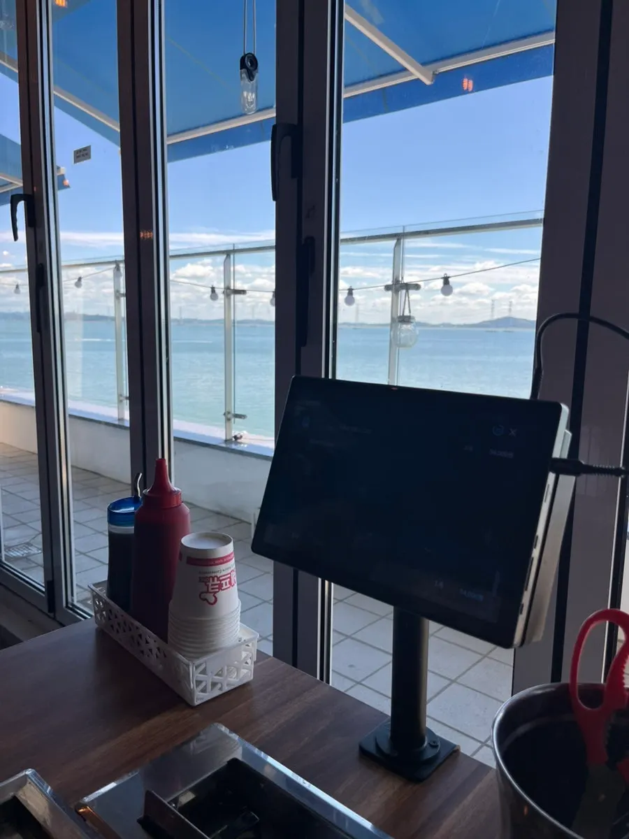 Ocean view through floor-to-ceiling windows at the window seat