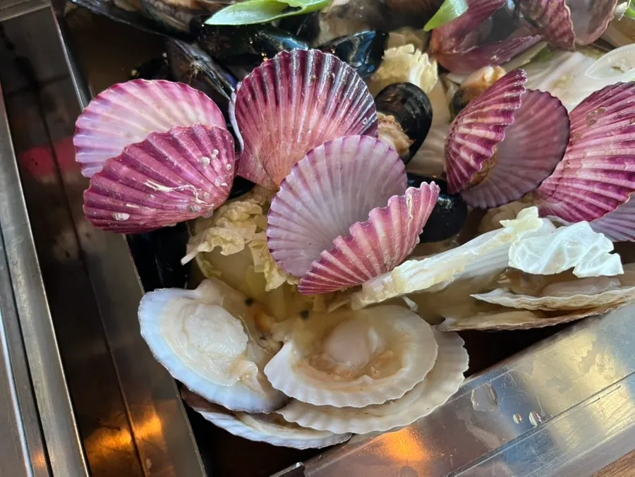 Steamed clam soup with scallops, abalone, and shrimp