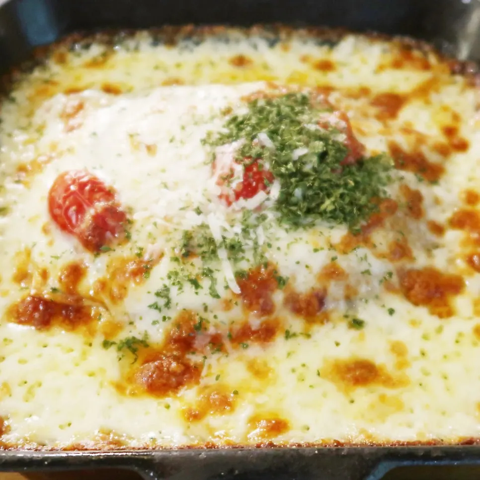 A slice of corn pizza with stretchy cheese