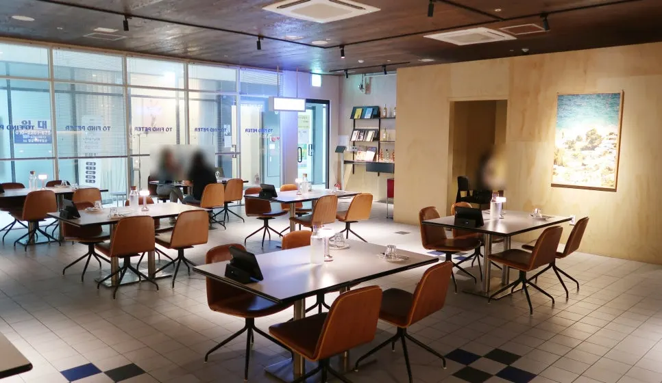 The dimly lit main hall of Two Find Peter Baegot Branch