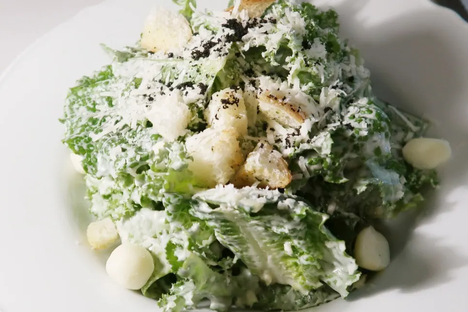A plate of Caesar salad at Two Find Peter