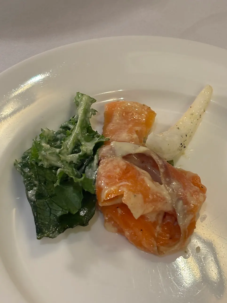 Smoked salmon salad with salmon over vegetables