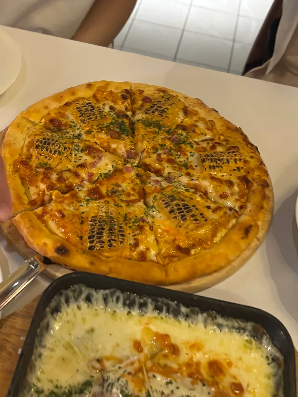 Corn pizza piled high with corn and cheese