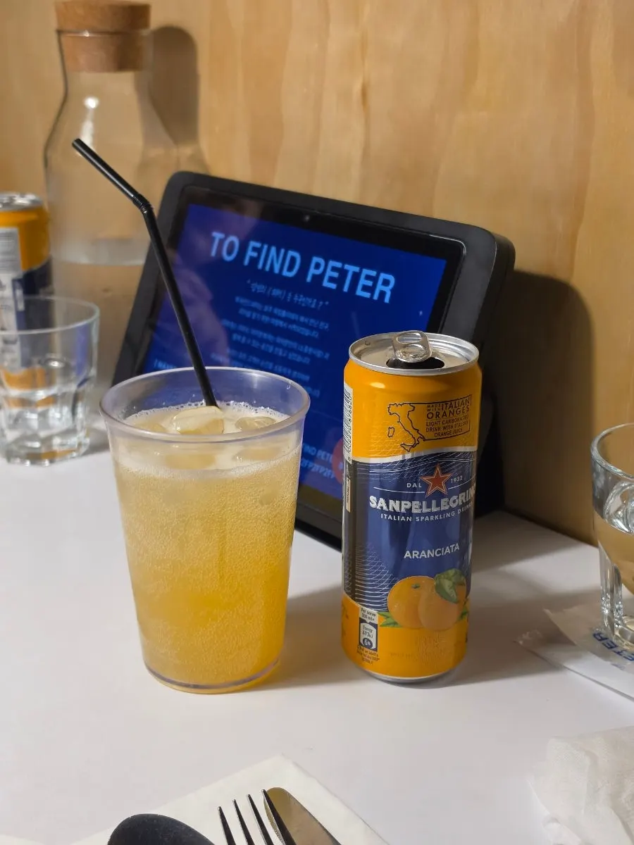 Glass of orange-flavored sparkling water