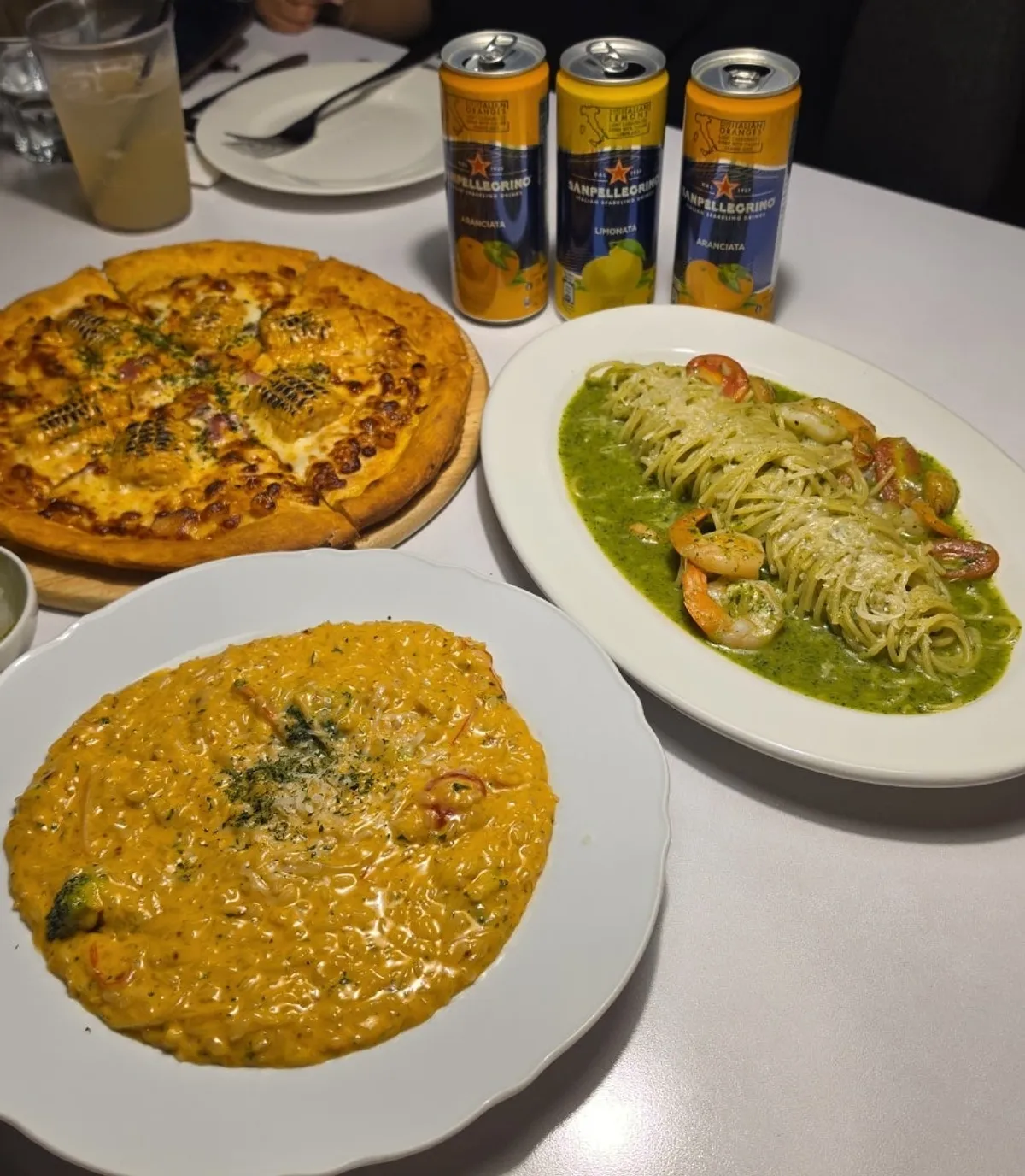 Table set with pizza, pasta and risotto
