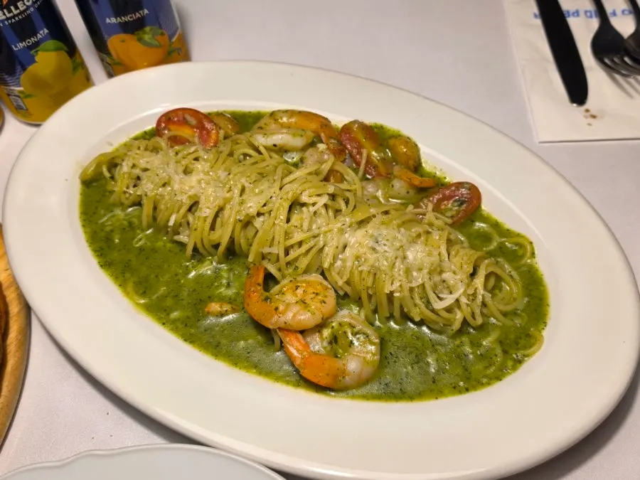 Shrimp basil oil pasta topped with shrimp
