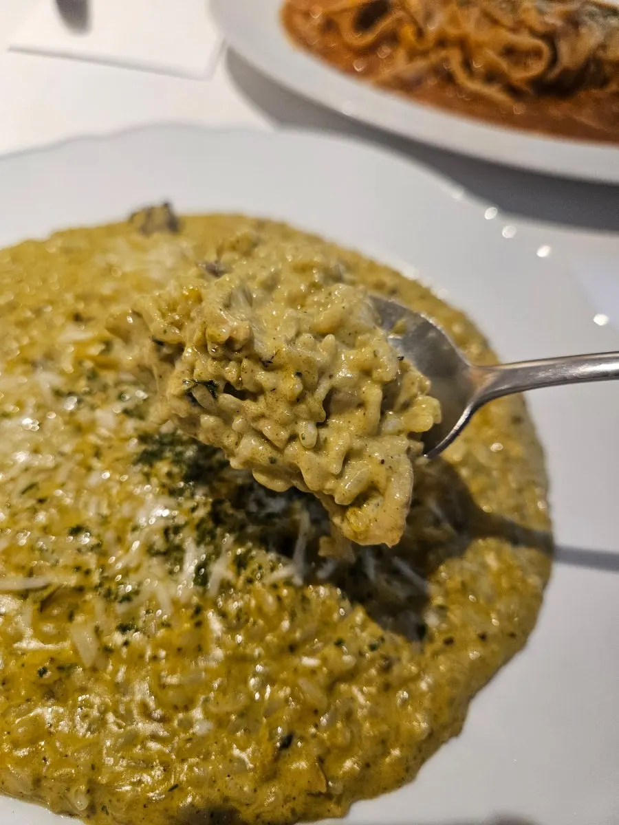 Close-up of cream risotto topped with abalone