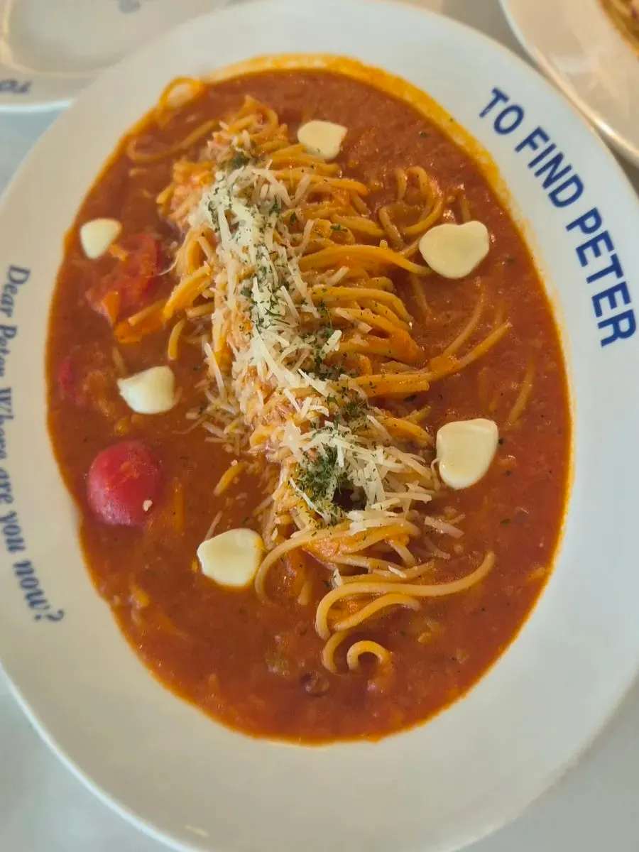 Tomato pasta topped with bocconcini cheese