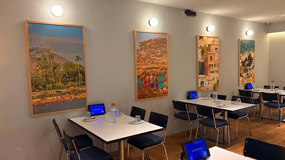 Full view of the dining hall with brown chairs