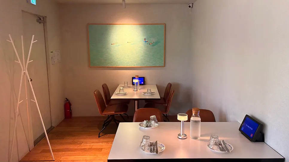 Seating area with photos hanging on the wall
