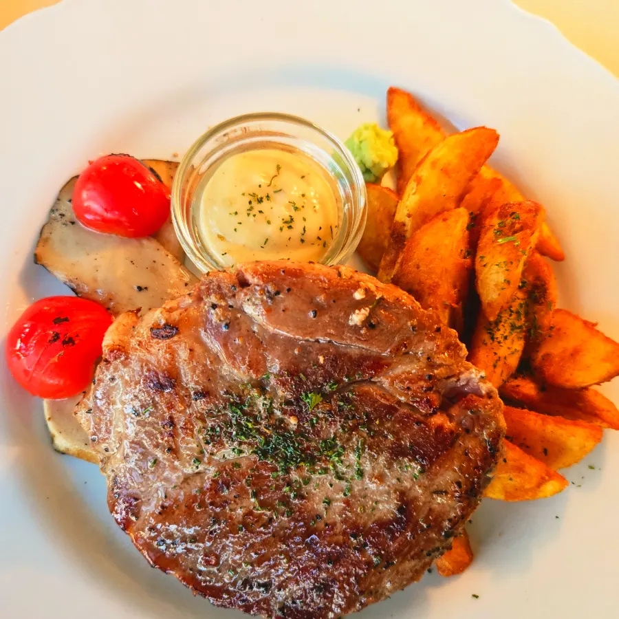 Springy carbonara noodles twirled on a fork
