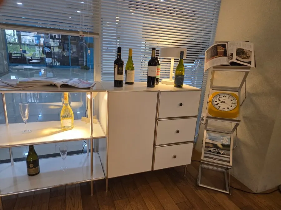 Restaurant interior with wooden flooring and white-toned furniture