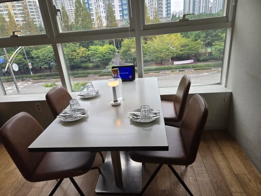Table setting with tableware, water bottle, and mood lamp