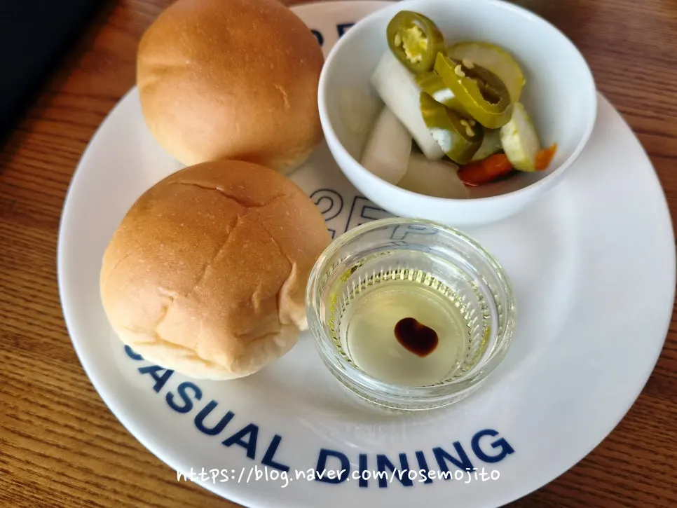 Complimentary bread served with balsamic oil and pickles