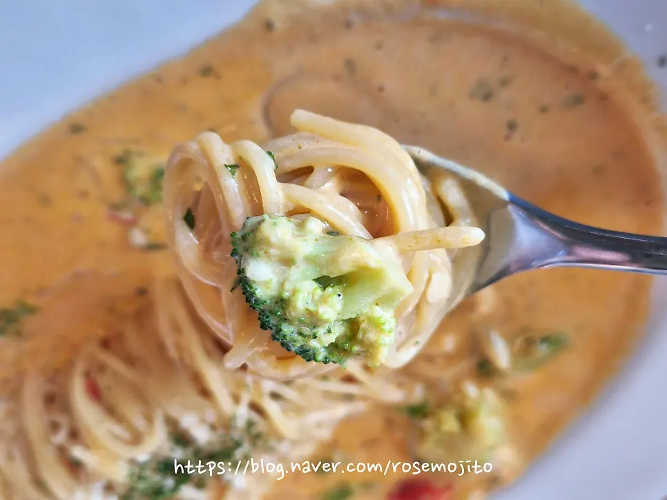 Fork twirling the spicy crebbi pasta noodles