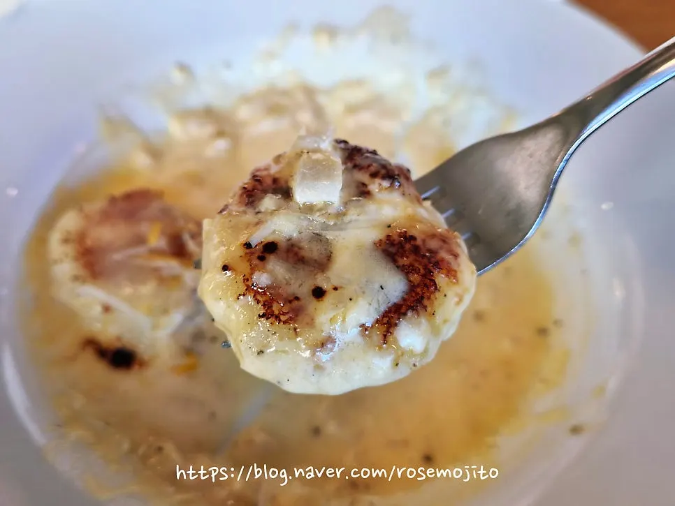 A spoonful of cheese-covered gnocchi