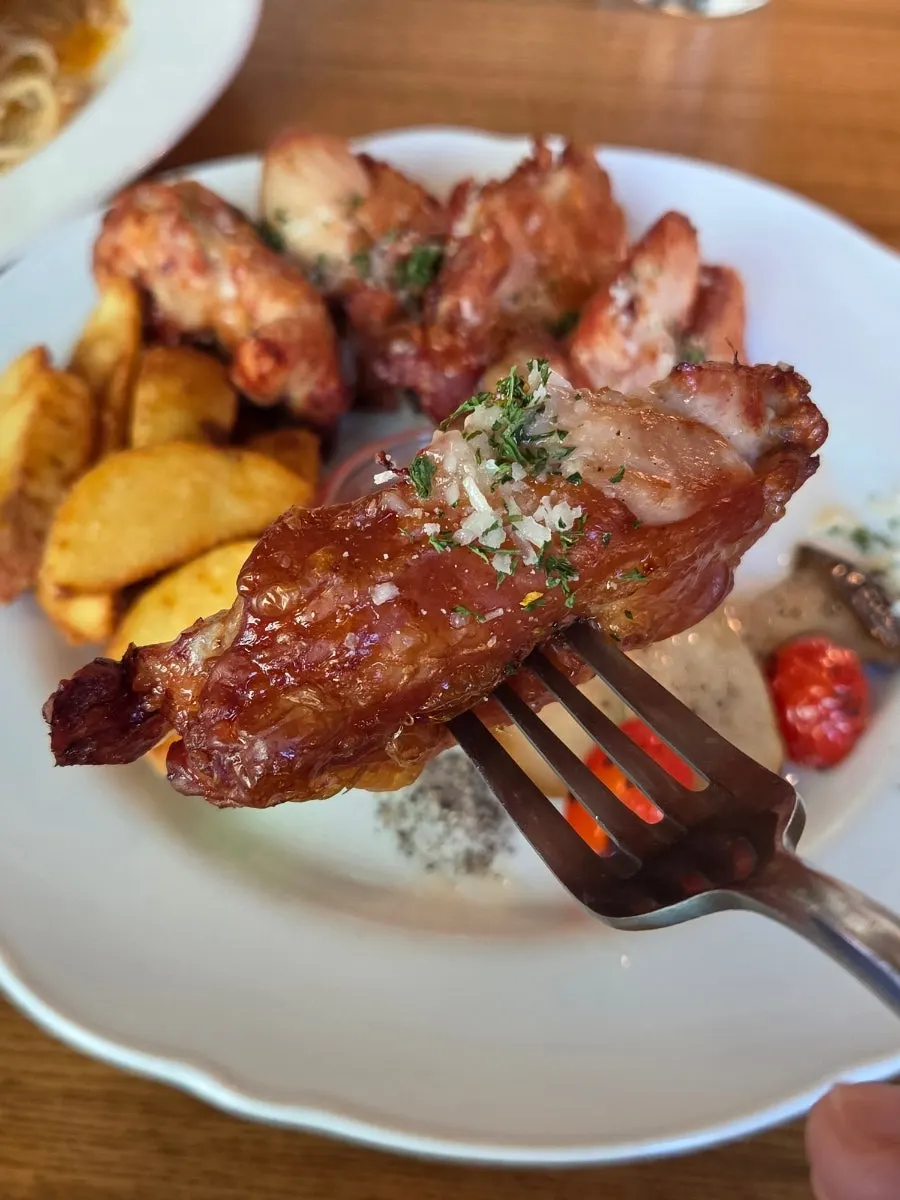 Sliced open smoked chicken steak showing juicy interior