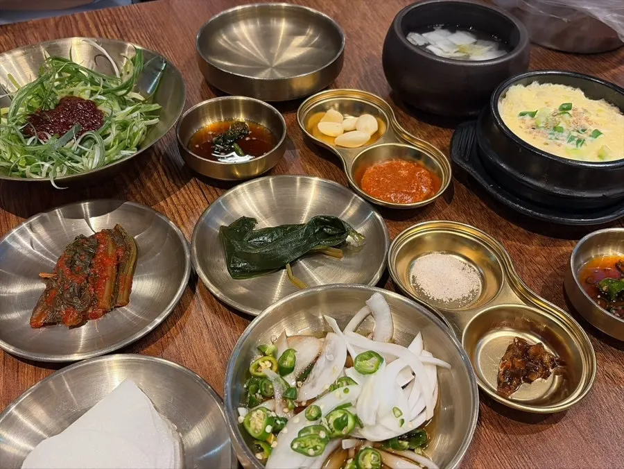Basic side dish spread with pickled green onion and myeongi namul
