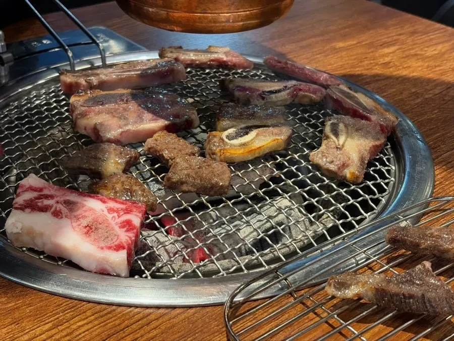 Beef fresh ribs grilling over charcoal