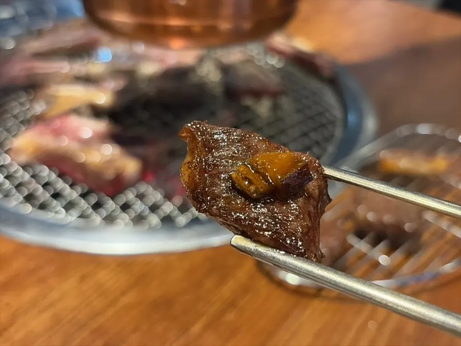 A piece of beef fresh rib with a hint of charcoal smoke