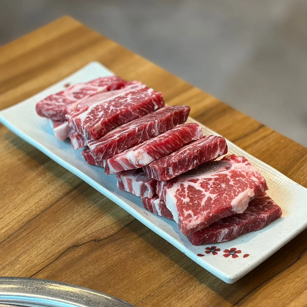Signature photo of charcoal-grilled raw short ribs at Ubookgeum Saenggalbi Seosin Branch